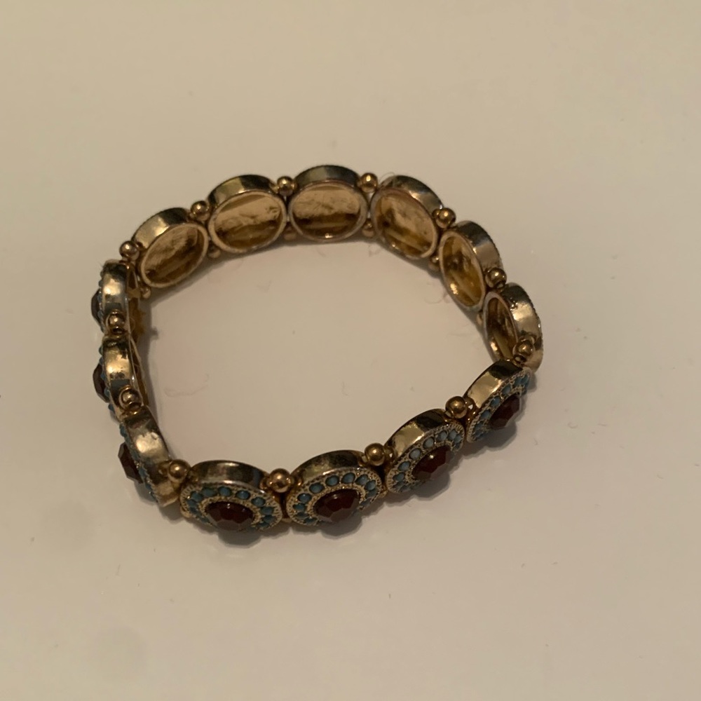 Gold bracelet with turquoise and purple stones